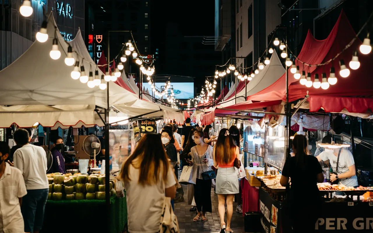 Warm lights above a lively evening market