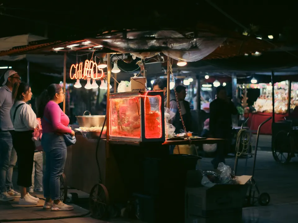 A welcoming vendor stall in an evening market